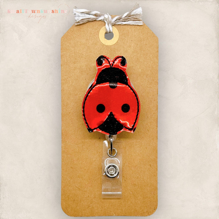 shiny embroidered vinyl badge reel