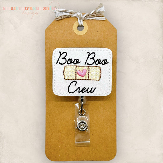 boo boo crew with an adhesive bandage badge reel