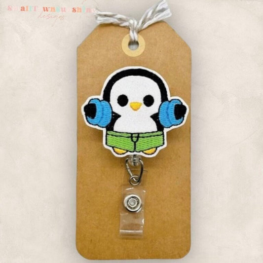 penguin with pool floaties badge reel