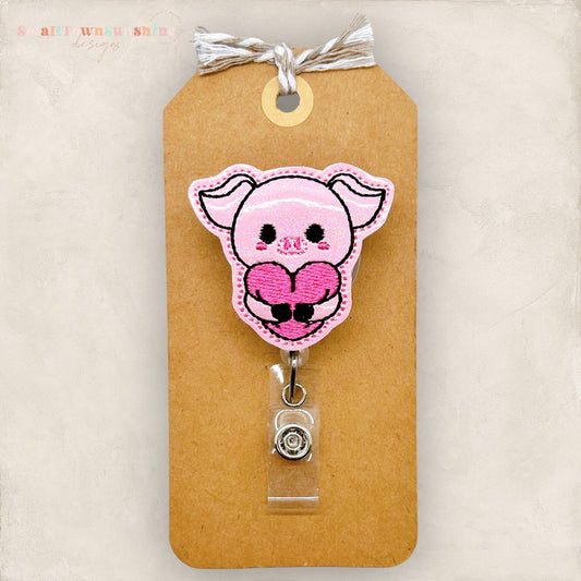 pig hugging heart embroidered badge reel