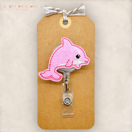 pink dolphin badge reel