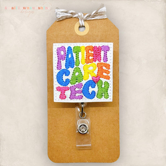 rainbow colored embroidered letters for patient care tech badge reel