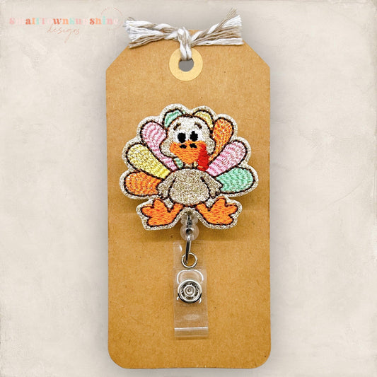 pastel feathered embroidered turkey badge reel