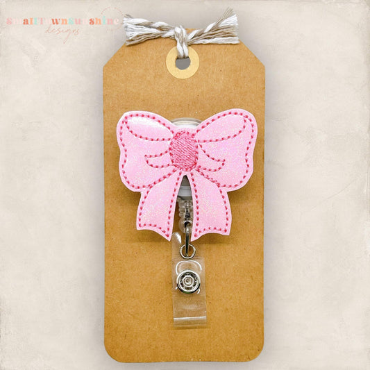 pretty pink bow badge reel