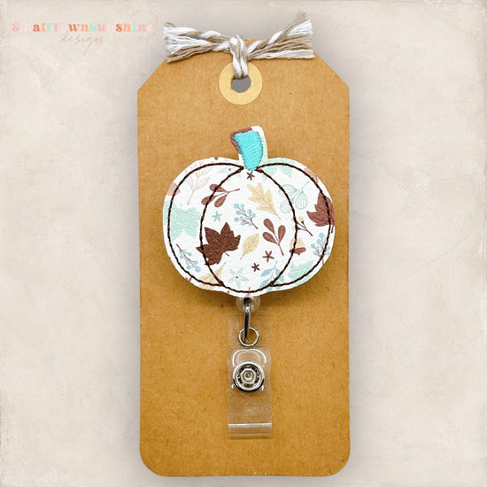fall leaf print, teal and brown leaves pumpkin badge reel
