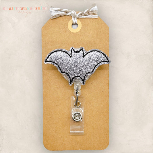 glittery grey bat badge reel