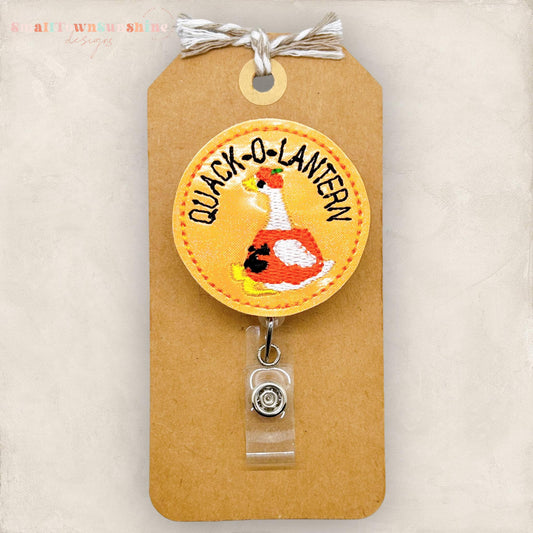 quack o lantern, duck dressed as halloween pumpkin badge reel