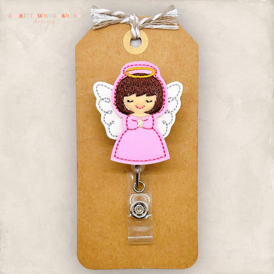 brown haired angel with pink dress with wings and halo embroidered badge reel