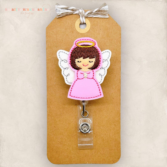 brown haired angel with pink dress with wings and halo embroidered badge reel
