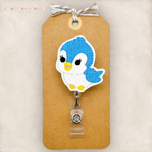embroidered blue bird badge reel
