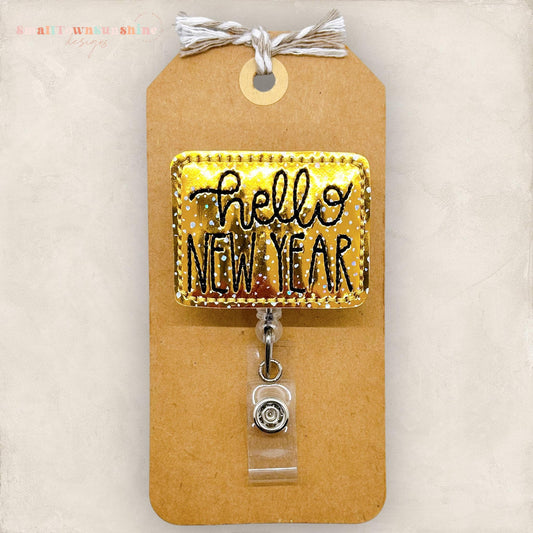 gold hello new year embroidered badge reel