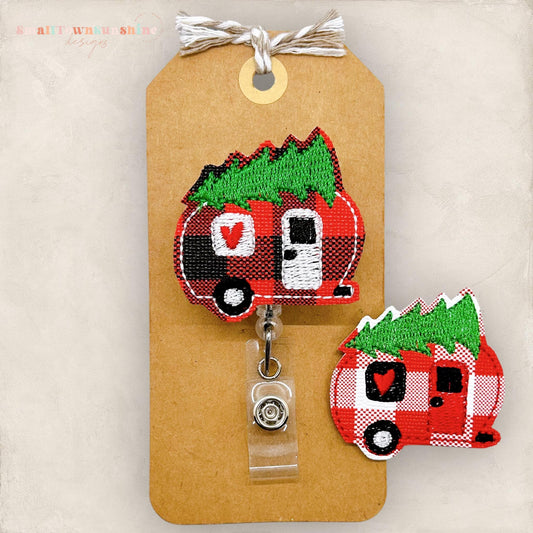 plaid christmas camper with a pine tree on top badge reel topper
