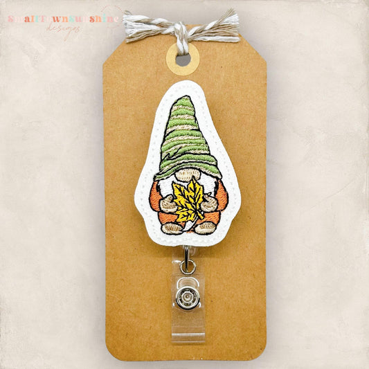 embroidered fall dressed gnome holding leaf badge reel topper