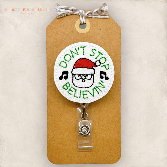 don&#39;t stop believing in santa embroidered badge reel
