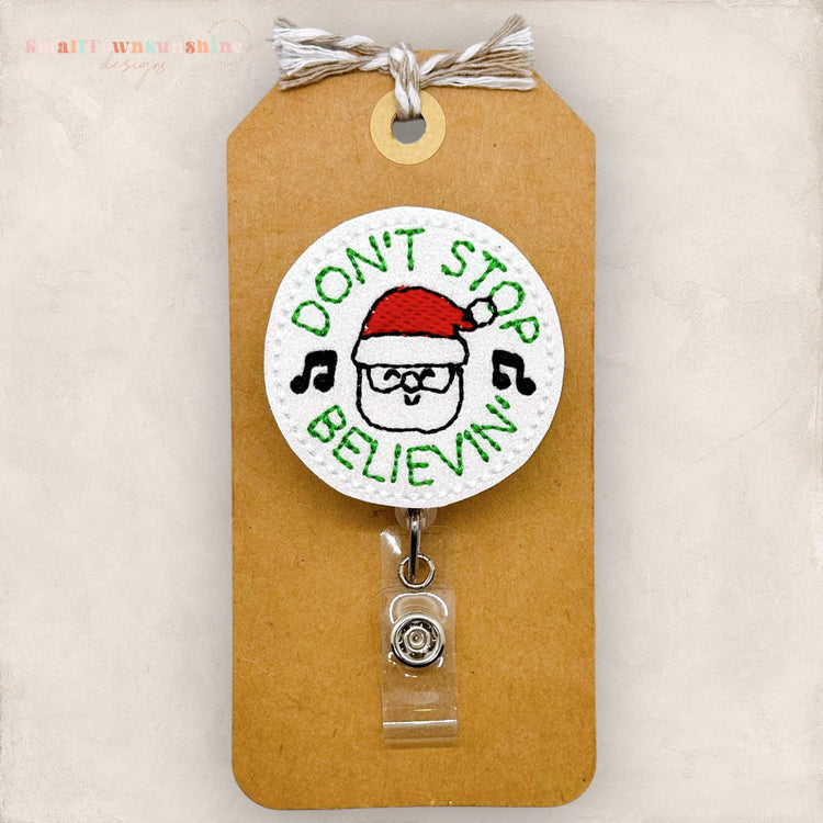 don&#39;t stop believing in santa embroidered badge reel