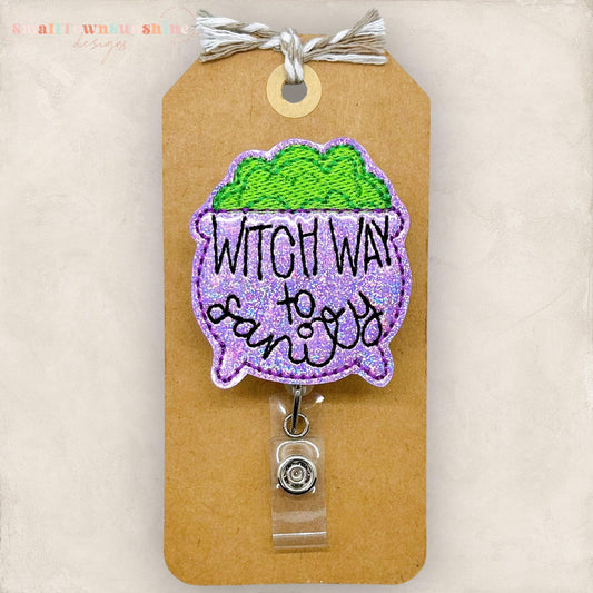 punny purple halloween cauldron embroidered badge reel
