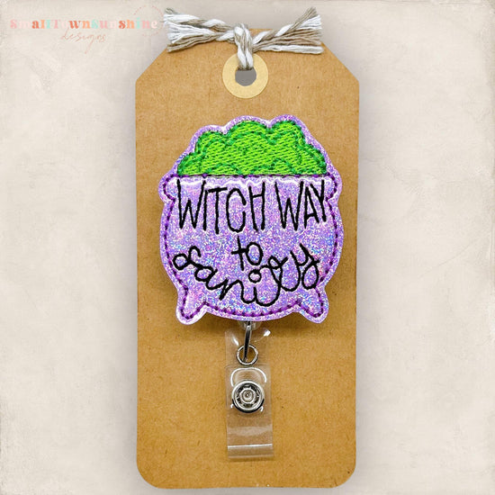 punny purple halloween cauldron embroidered badge reel