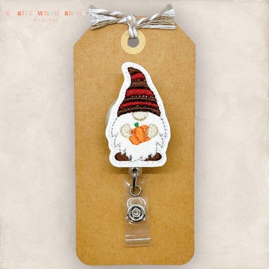 gnome holding pumpkin embroidered badge reel topper