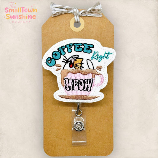 cat in a coffee cup saying coffee right meow badge reel topper