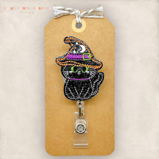 embroidered black cat with witch hat badge reel