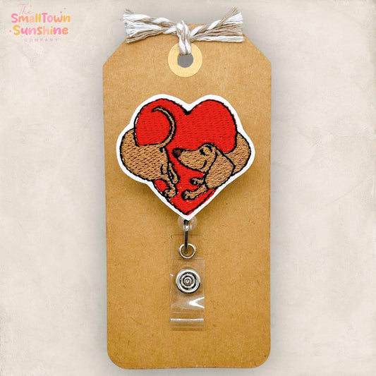 weenie dog hugging heart badge reel topper