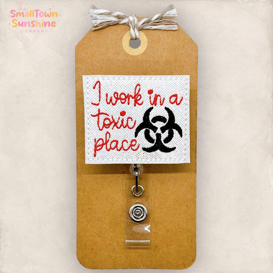 I Work in a Toxic Place Badge Topper
