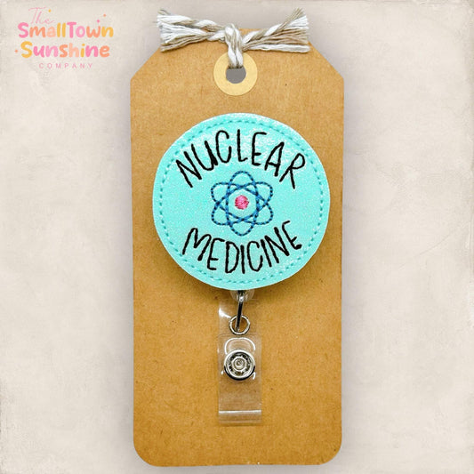 nuclear medicine with embroidered atom badge reel topper