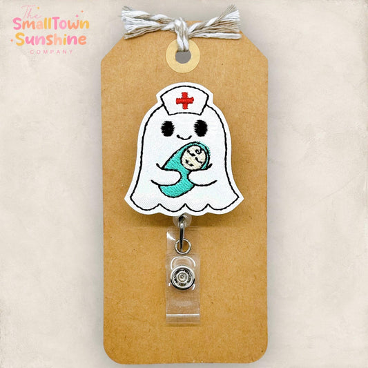 ghost with nurse hat holding swaddled baby embroidered badge reel topper