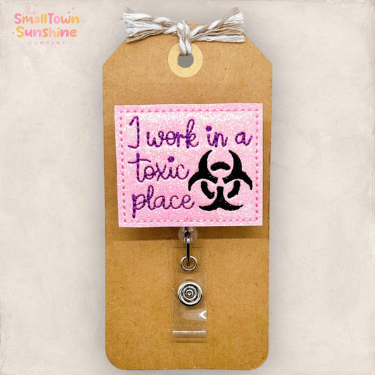 I Work in a Toxic Place Badge Topper