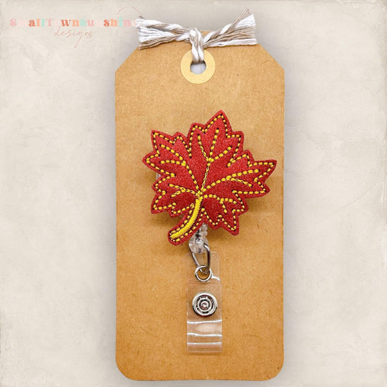 fall colored maple leaf badge reels
