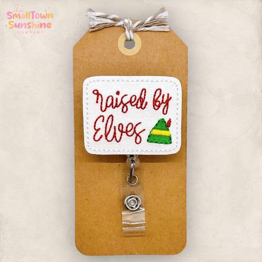 Raised by Elves Badge Reel, Christmas Name Tag, Nurse Badge Clip, Teacher Lanyard, Coworker Gift, Retractable ID Holder | GLITTER