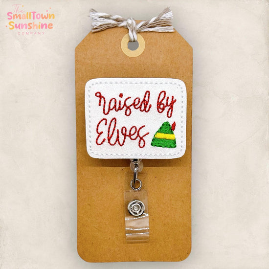 Raised by Elves Badge Reel, Christmas Name Tag, Nurse Badge Clip, Teacher Lanyard, Coworker Gift, Retractable ID Holder | GLITTER